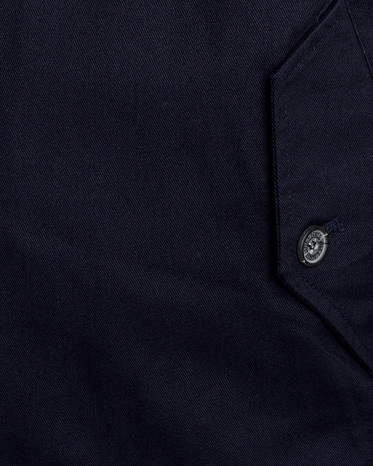 Man wears Cotton Harrington Jacket in Dark Navy