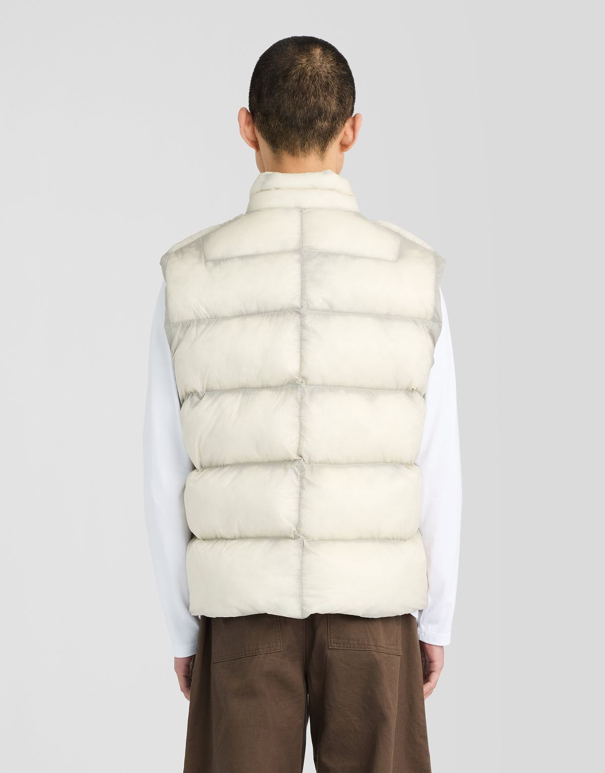 Man wearing Translucent Puffer Gilet in Putty