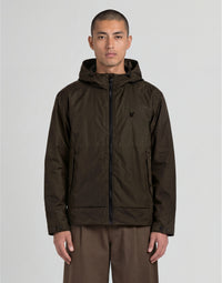 Man wears Heat Reactive Shell Jacket in Washed Brown / Cove
