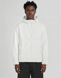 Man wears Glow Reactive Wadded Shell Jacket in Glow in the Dark White
