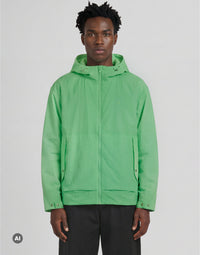 Man wears Glow Reactive Wadded Shell Jacket in Glow in the Dark White