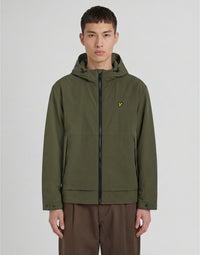 Man wears Water Reactive Shell Jacket in Olive Green