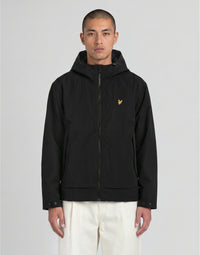 Man wears Water Reactive Shell Jacket in Black