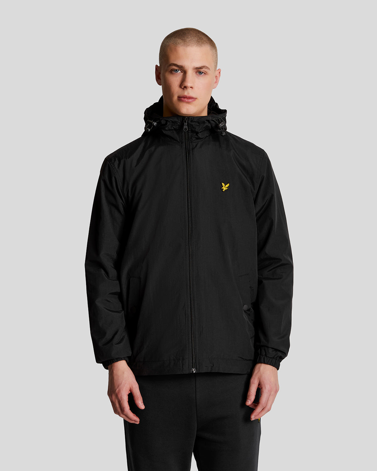 Man wears Water Resistant Hooded Jacket in Jet Black