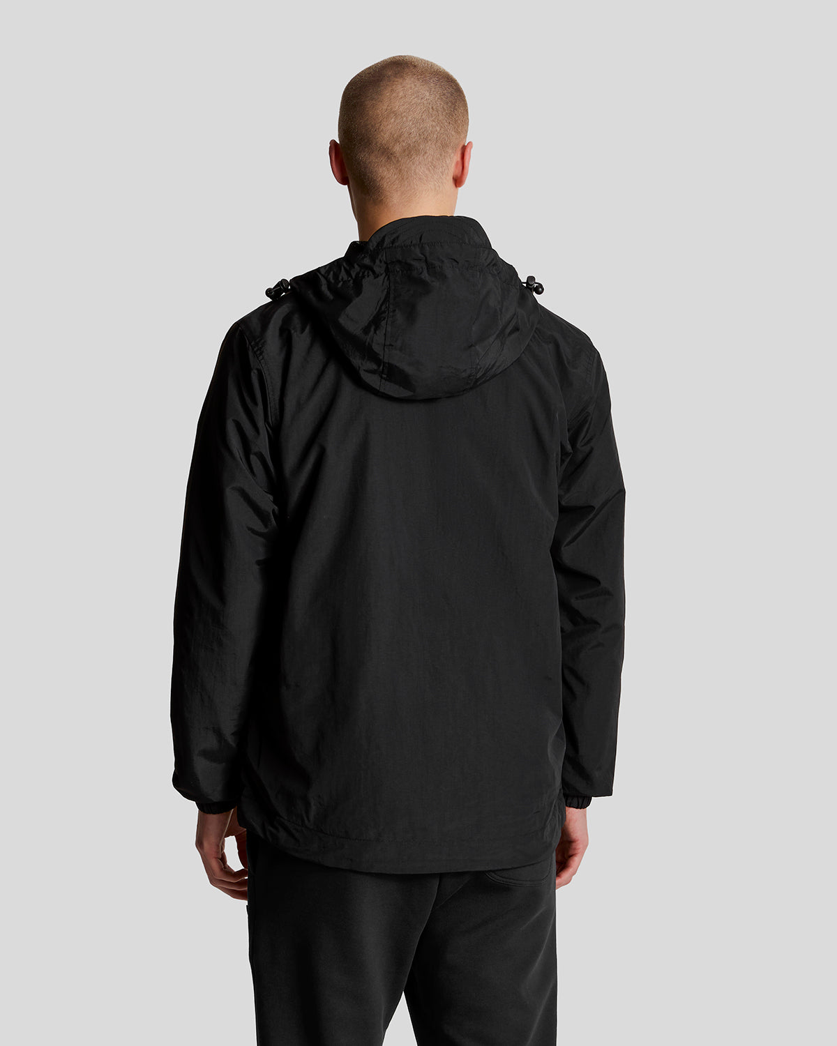 Man wears Water Resistant Hooded Jacket in Jet Black