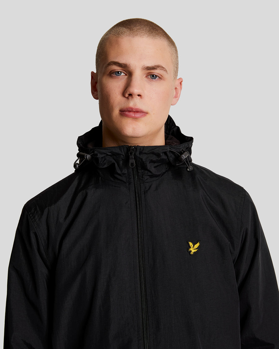 Man wears Water Resistant Hooded Jacket in Jet Black
