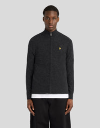 Man wears Lambswool Blend Zip Cardigan in Jet Black Marl