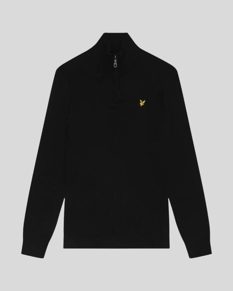 Man wears Cotton Merino 1/4 Zip Jumper in Jet Black