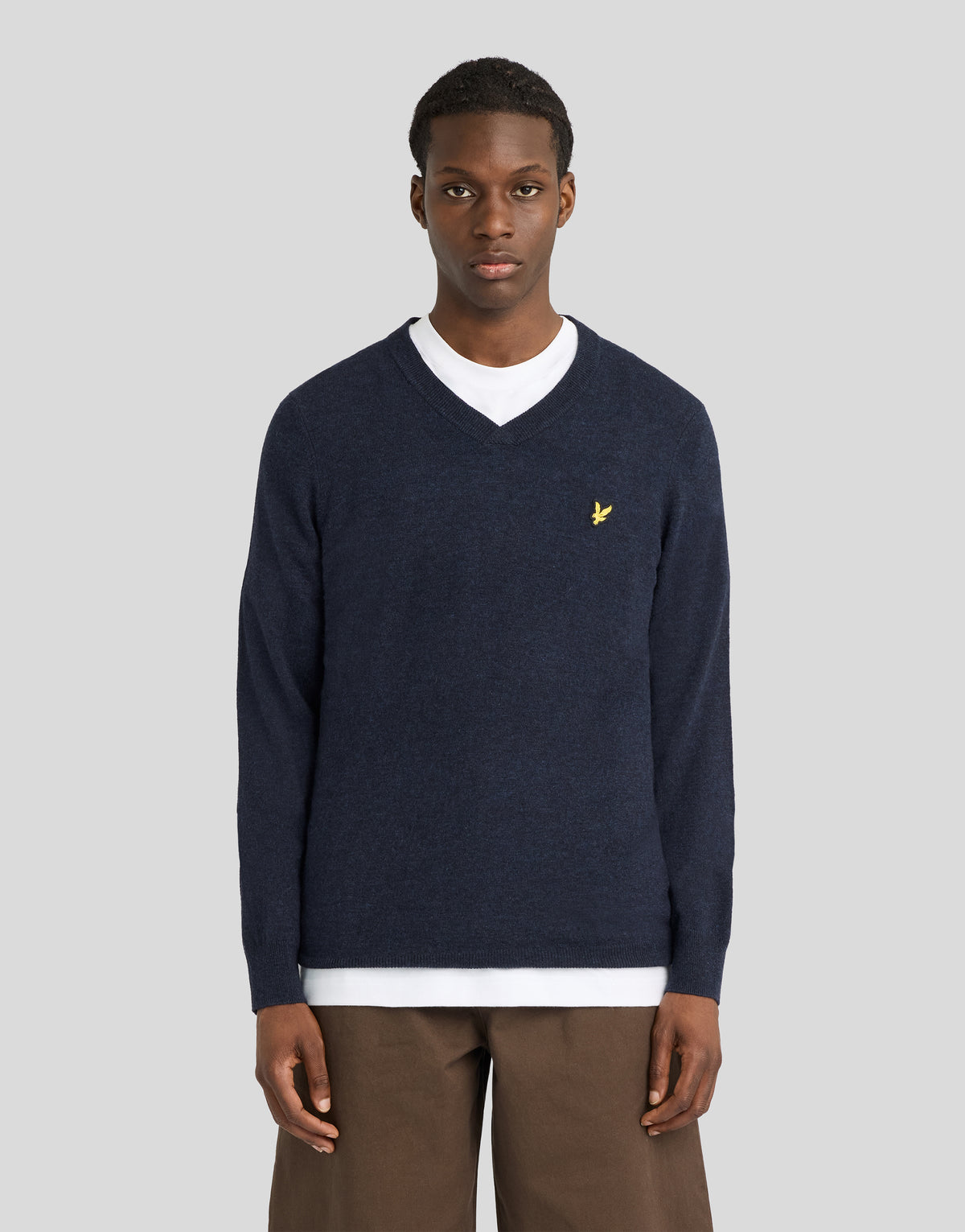 Man wearing Lambswool Blend V-Neck Jumper in Dark Navy Marl