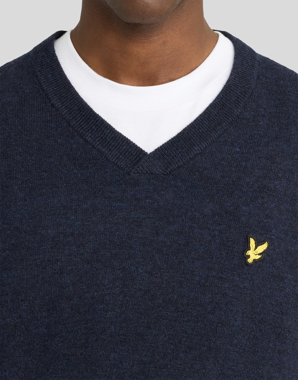 Man wearing Lambswool Blend V-Neck Jumper in Dark Navy Marl