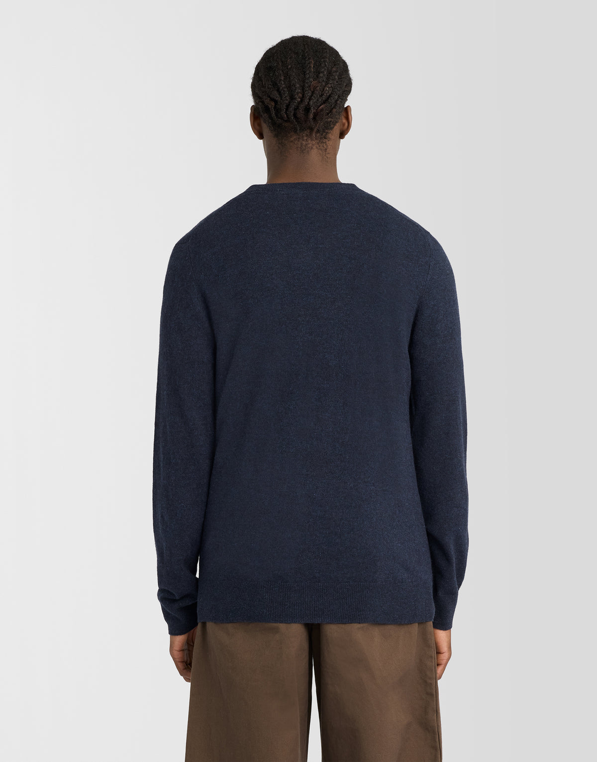Man wearing Lambswool Blend V-Neck Jumper in Dark Navy Marl