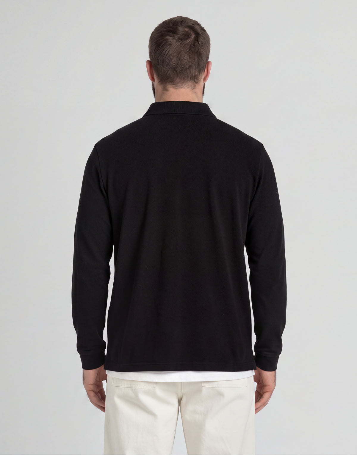 Man wears Big & Tall Long Sleeve Polo Shirt Plus in Jet Black