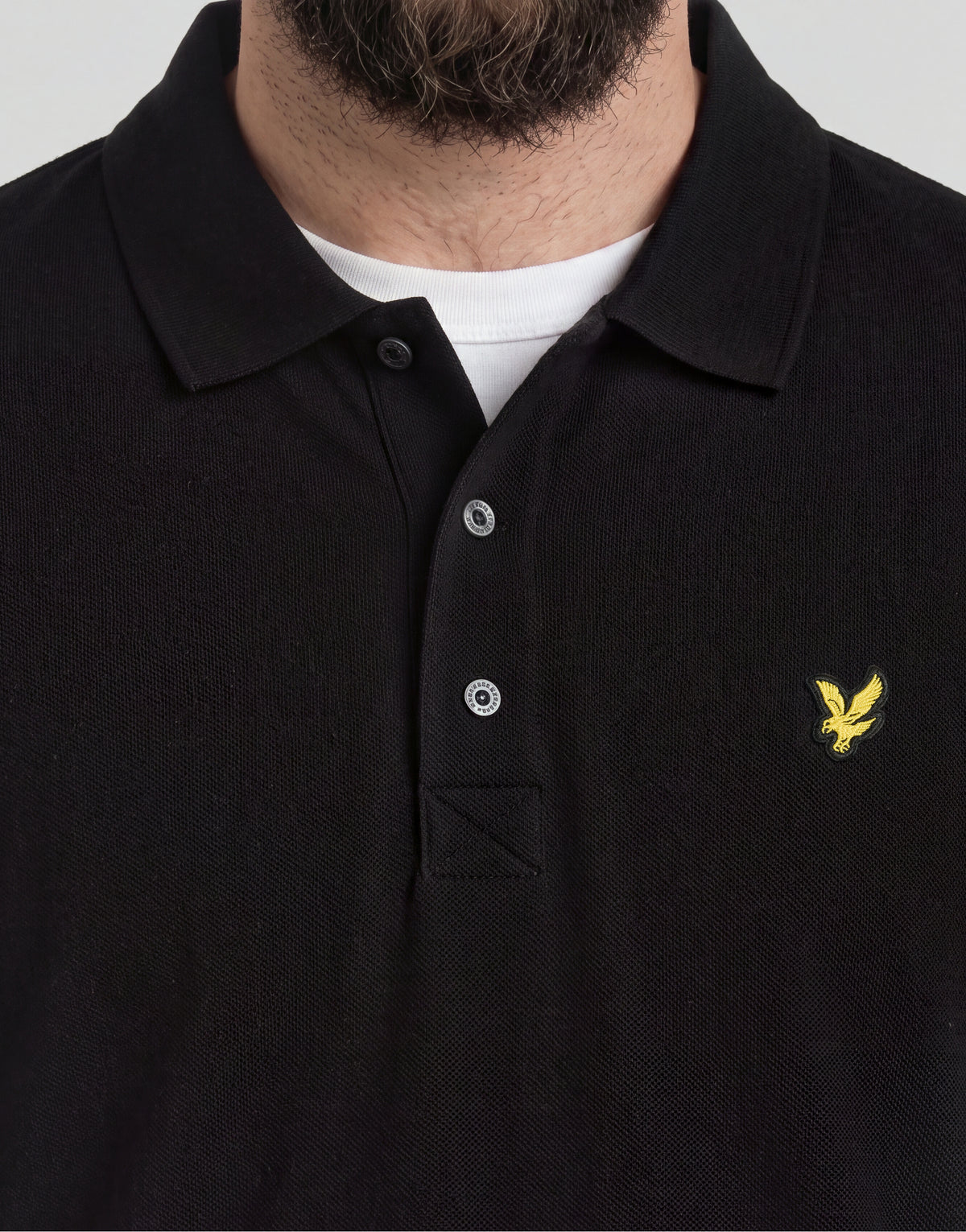 Man wears Big & Tall Long Sleeve Polo Shirt Plus in Jet Black