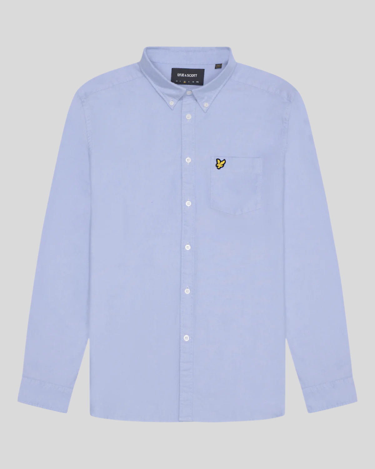Man wears Cotton Button Down Oxford Shirt in Riviera
