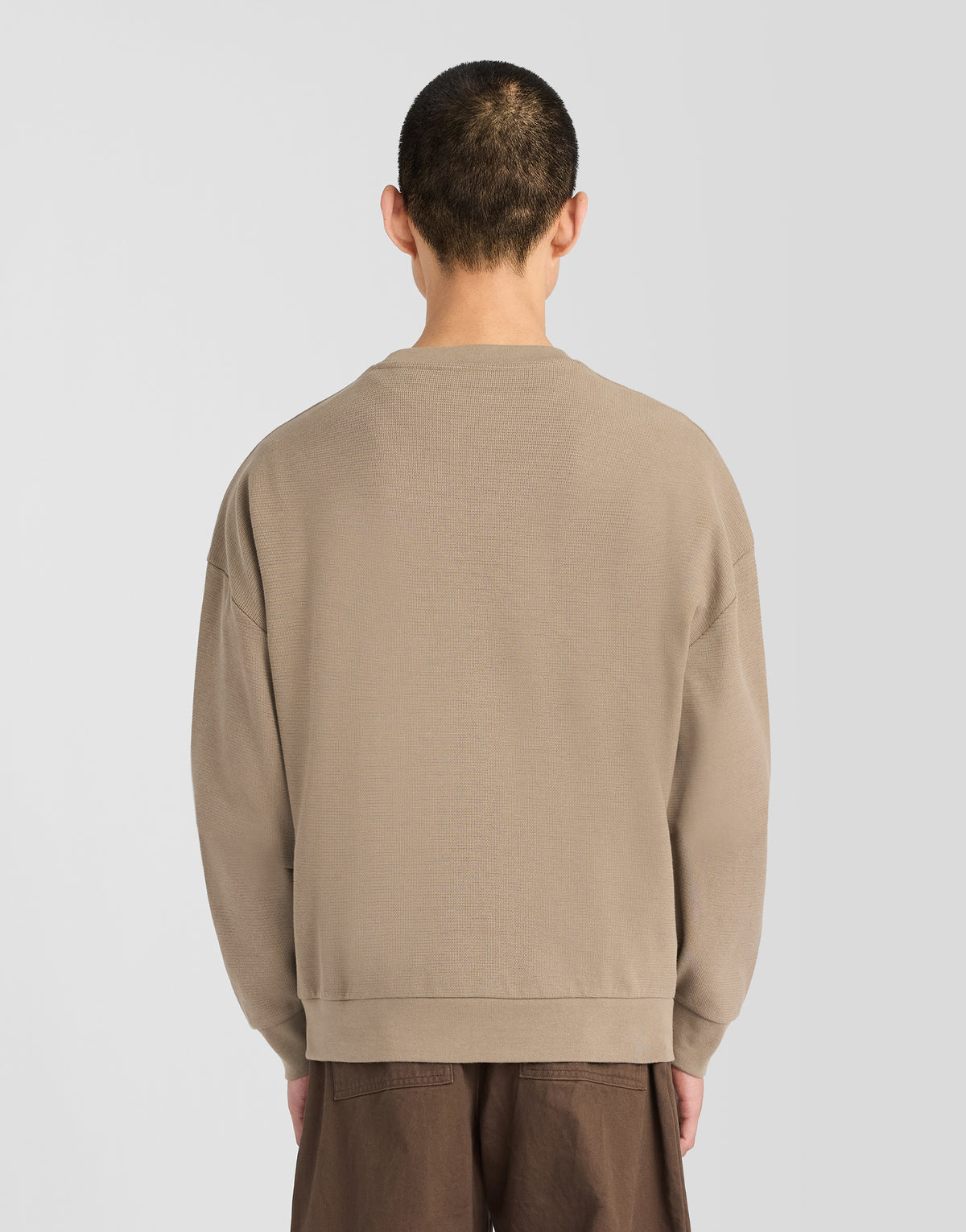 Man wearing Textured Rib Crew Neck Sweatshirt in Khaki Ash
