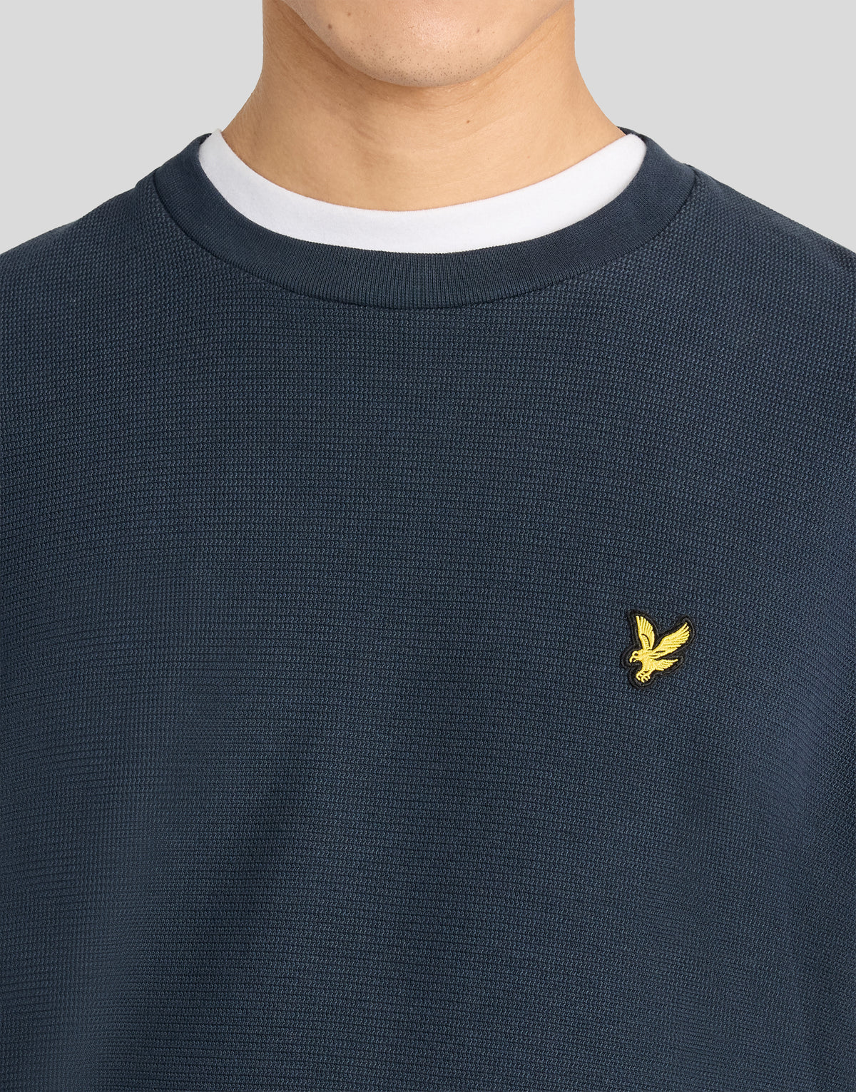 Man wearing Textured Rib Crew Neck Sweatshirt in Dark Navy