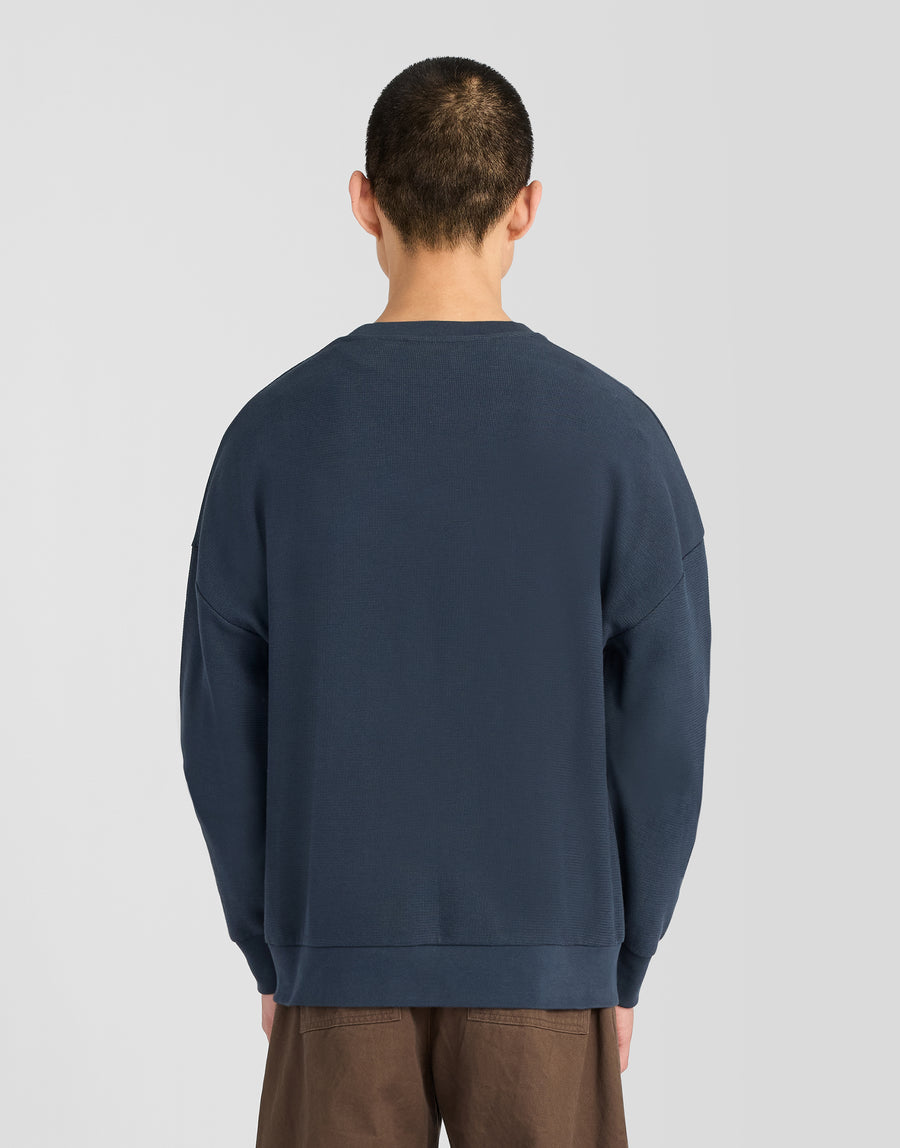 Man wearing Textured Rib Crew Neck Sweatshirt in Dark Navy