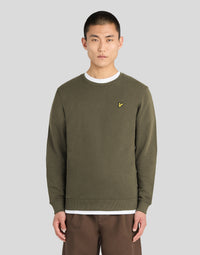 Mann trägt ein Baumwoll-Sweatshirt mit Rundhalsausschnitt in der Farbe „Khaki Ash“
