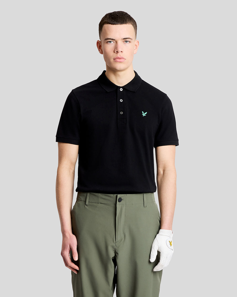 Man wears Green Eagle Cotton Polo Shirt in Jet Black