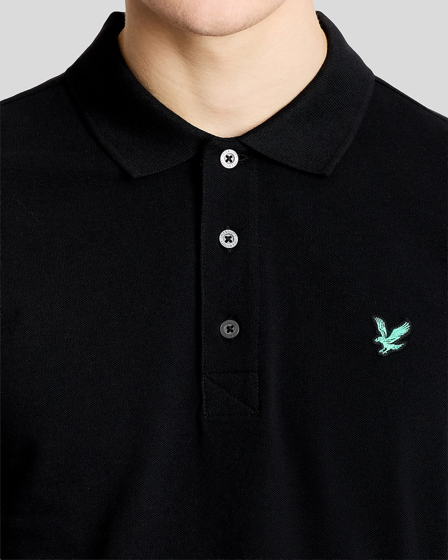 Man wears Green Eagle Cotton Polo Shirt in Jet Black