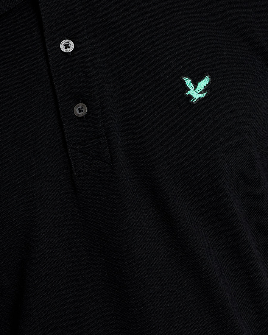 Man wears Green Eagle Cotton Polo Shirt in Jet Black