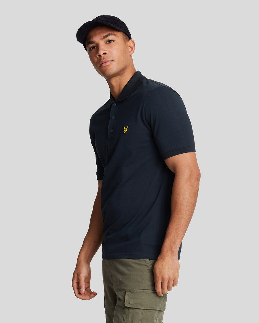 Man wears Cotton Polo Shirt in Dark Navy