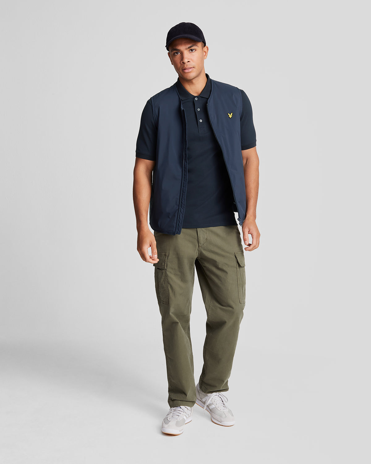 Man wears Cotton Polo Shirt in Dark Navy