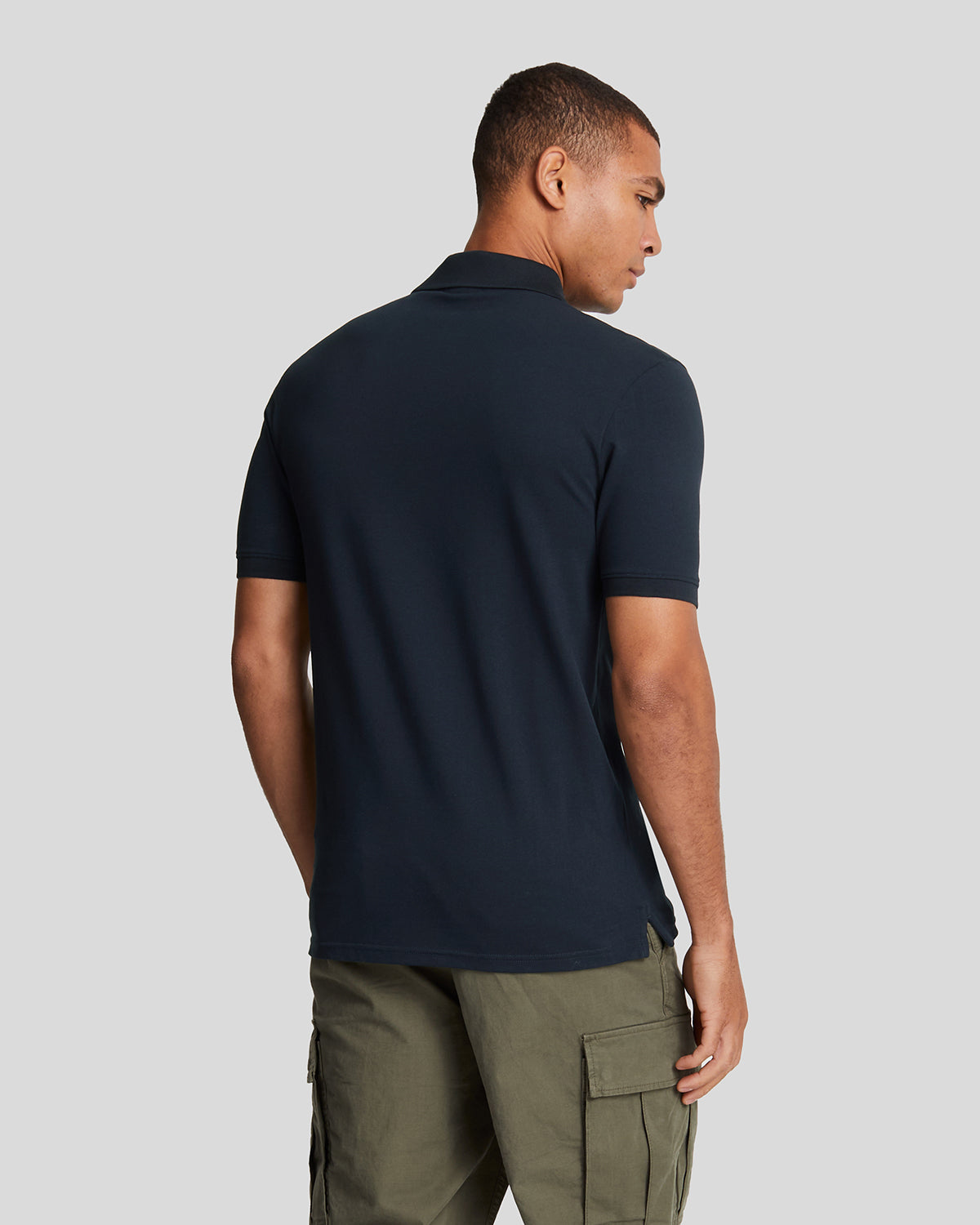 Man wears Cotton Polo Shirt in Dark Navy