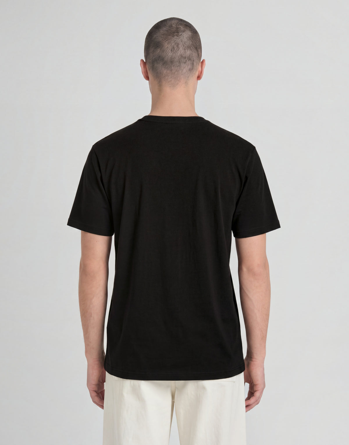 Man draagt een ‘Man wears’ Archive katoenen T-shirt in Jet Black