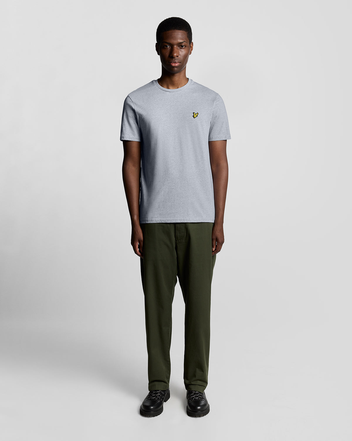 Man wears Cotton Crew Neck T-Shirt in Light Grey Marl