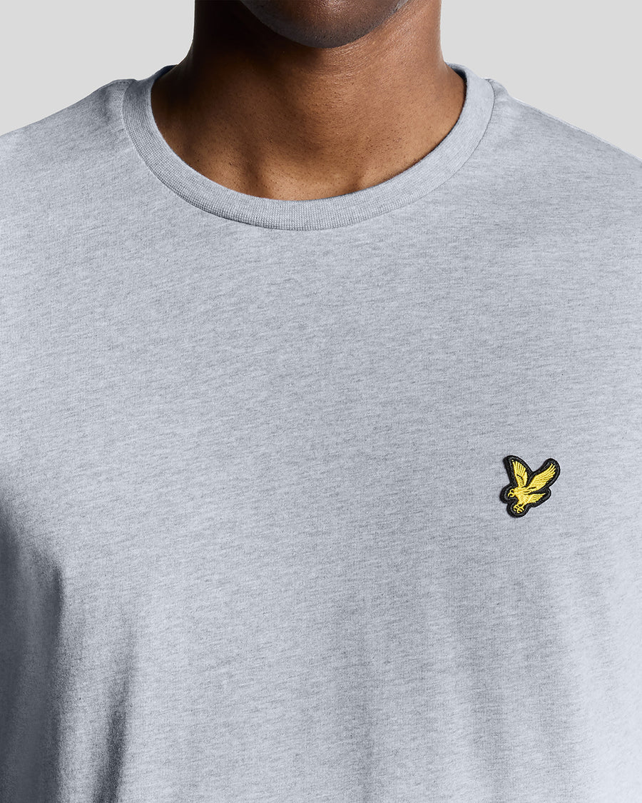 Man wears Cotton Crew Neck T-Shirt in Light Grey Marl