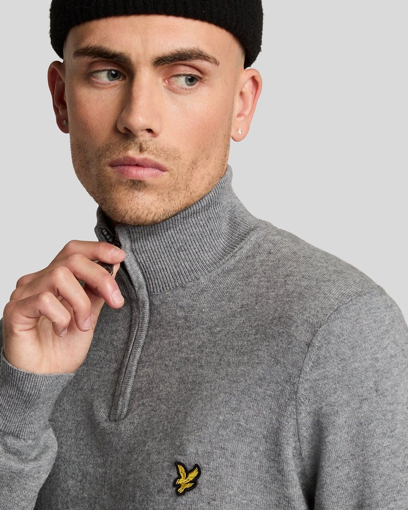 Man wears Cotton Merino 1/4 Zip Jumper in Mid Grey Marl