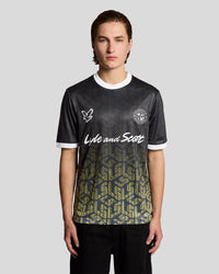 Man wears Ombre Emblem Football Shirt in Jet Black