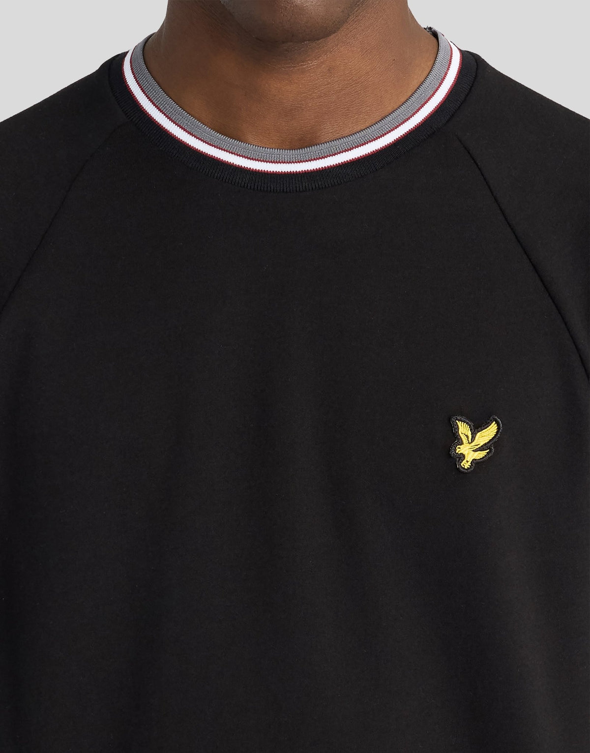 Man wears Tipped Track T-Shirt in Jet Black
