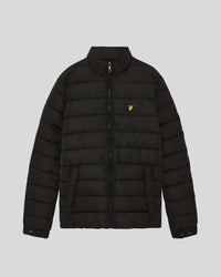 Man wears Quilted Jacket in Jet Black