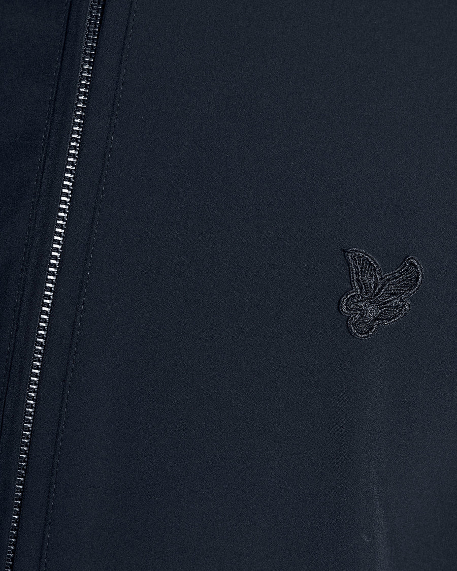 Man wears Lightweight Softshell Jacket in Carbon