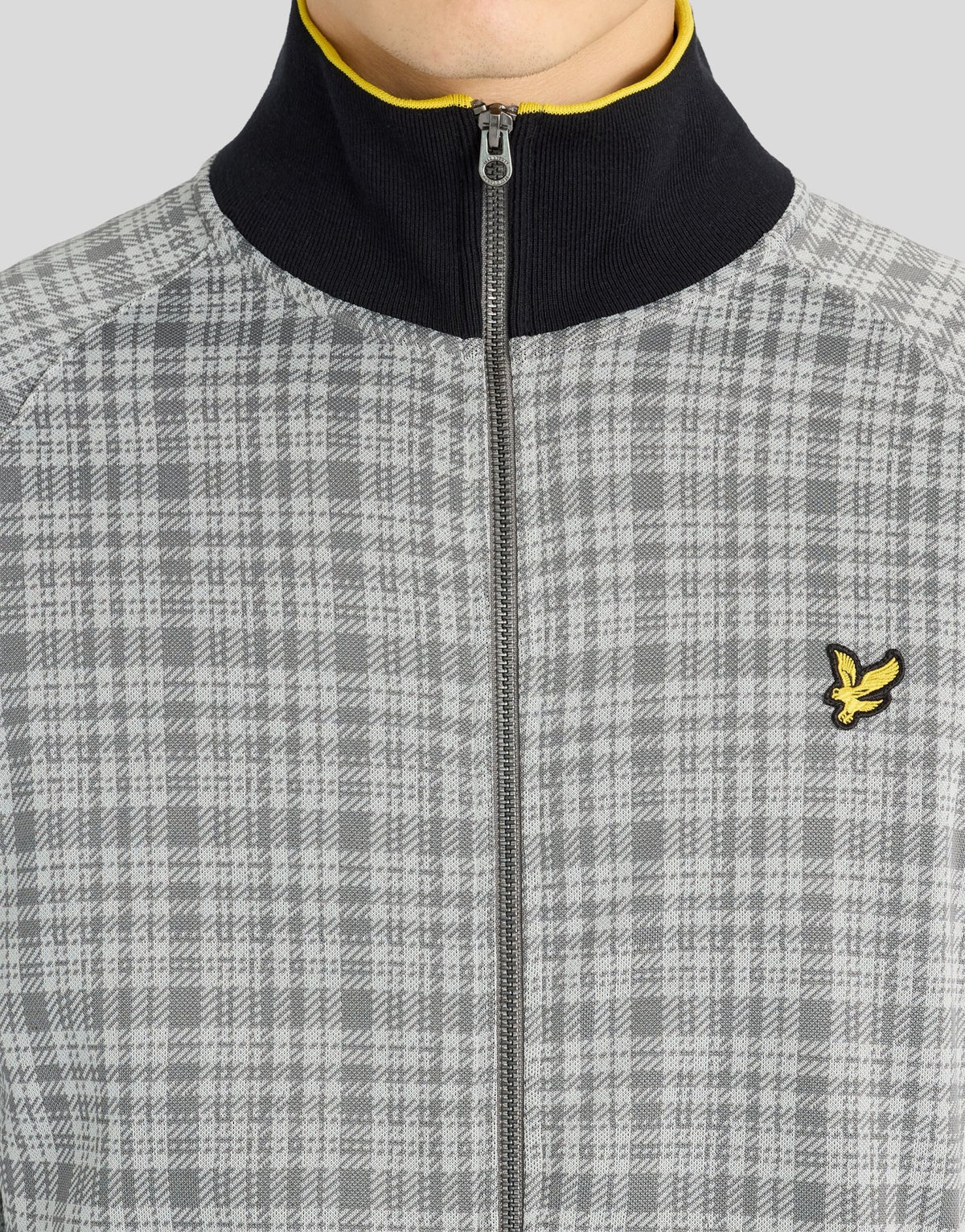 Man wears Hawick Cotton Check Track Jacket in Mid Grey Marl