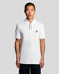 Man wears Placket Tipped Polo Shirt in White