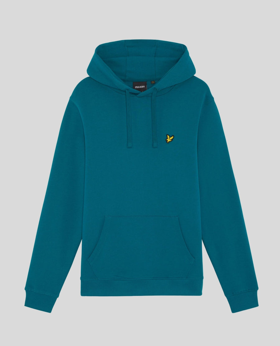 Un homme porte un sweat à capuche en coton Loopback, couleur Lagoon