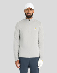 Man wears Quilted 1/4 Zip Midlayer in Ultimate Grey