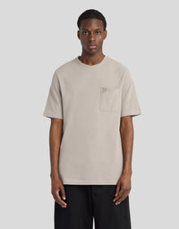 Man wears Pique Interlock Cotton T-Shirt in Clay Taupe