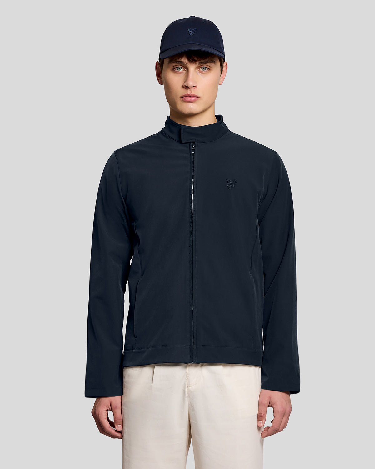 Man wears Lightweight Softshell Jacket in Carbon