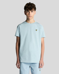 Man wears Cotton Crew Neck T-Shirt in Opal Blue
