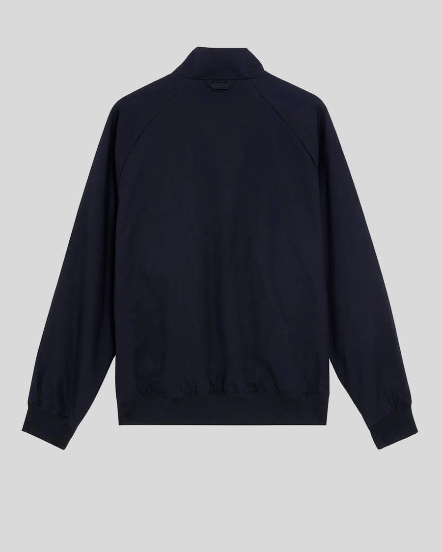Man wears Cotton Harrington Jacket in Dark Navy