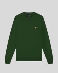 Man wears Cotton Merino Crew Neck Jumper in Clover Green