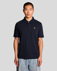 Man wears Jacquard Tipped Polo Shirt in Dark Navy
