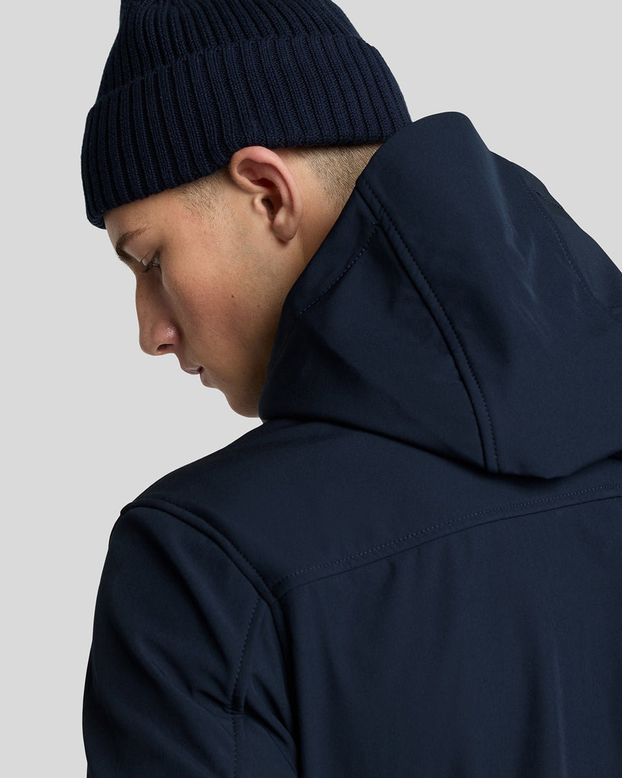 Man wears Fleece Lined Softshell Jacket in Dark Navy