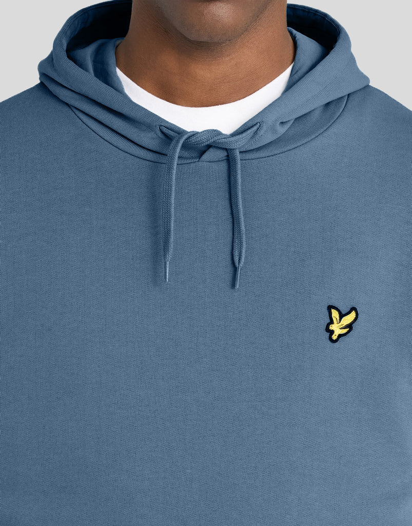 Man wears Everyday Loopback Cotton Hoodie in Ocean Sky