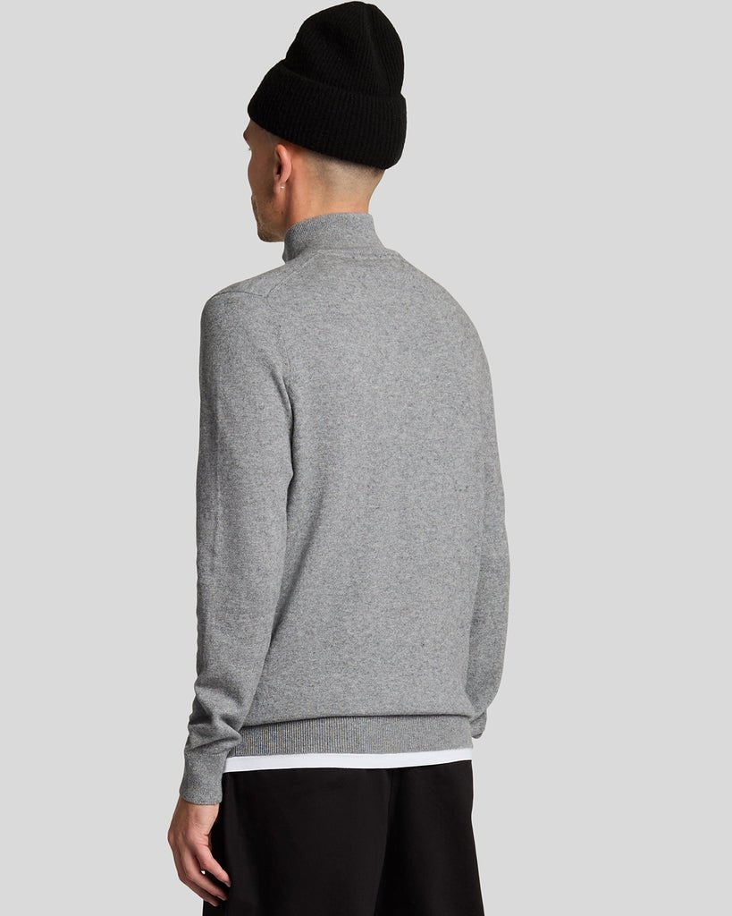 Man wears Cotton Merino 1/4 Zip Jumper in Mid Grey Marl