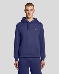 Man wears Loopback Cotton Hoodie in Rich Navy